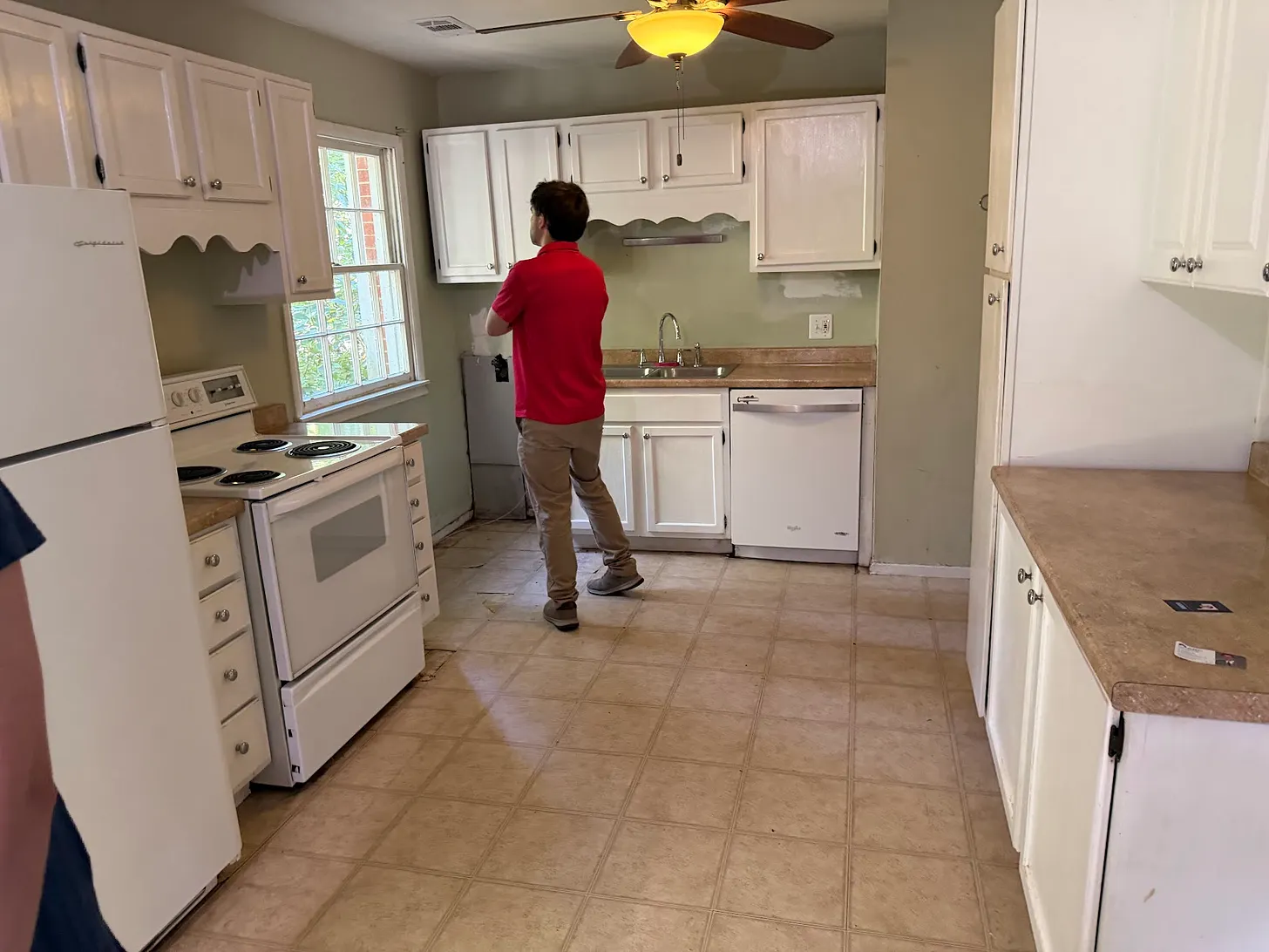 My son is looking out the window of our first home.